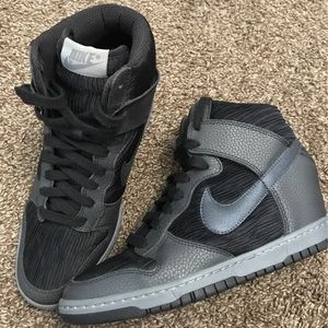 Nike swoosh shoes with heel.